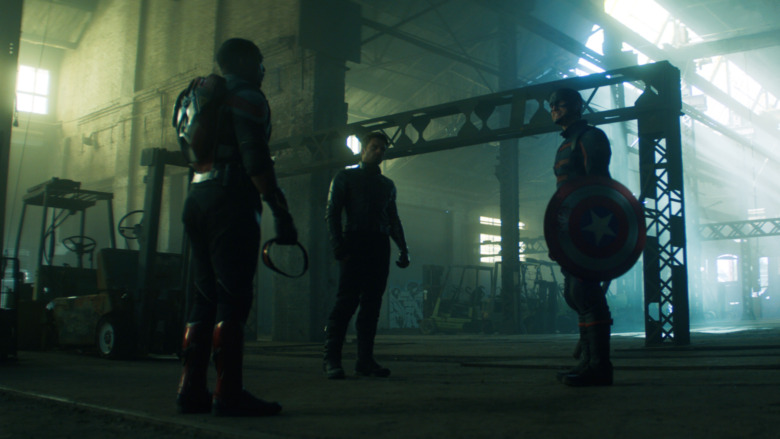 Bucky, Sam, and John Walker in warehouse