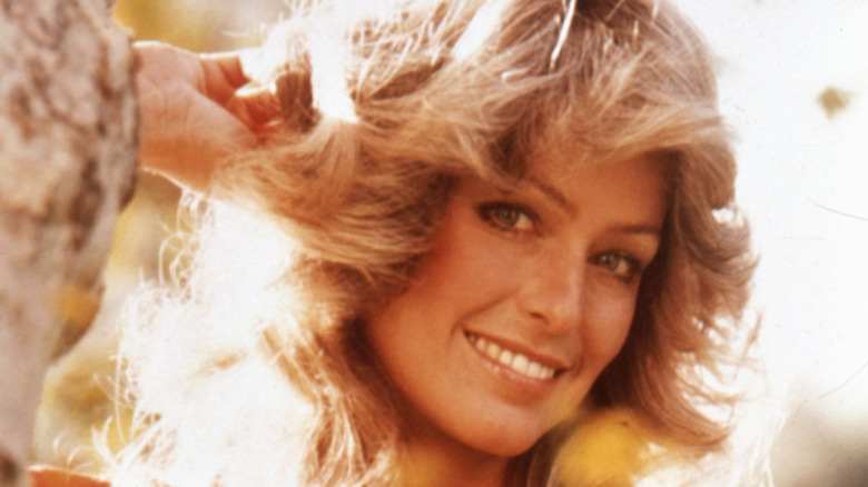 Farrah Fawcett turns her head and smiles