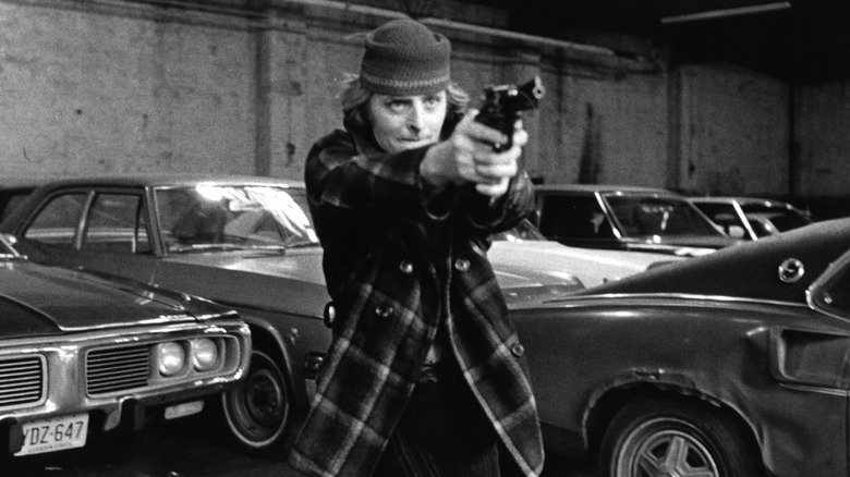 Richard Lynch aims gun