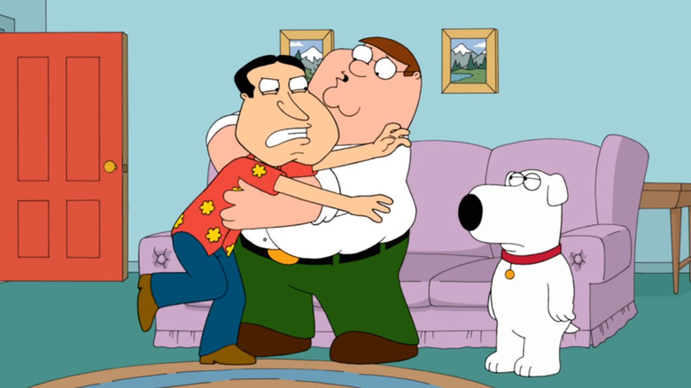 Peter holding back Quagmire