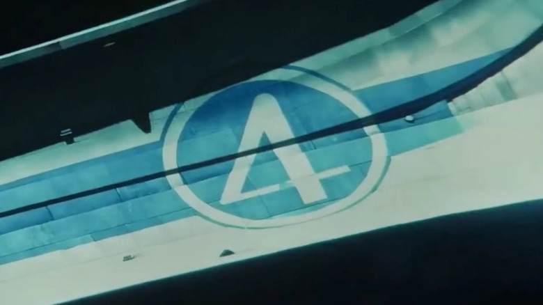 Close-up of the Fantastic Four logo on a spaceship approaching Earth in Thunderbolts*