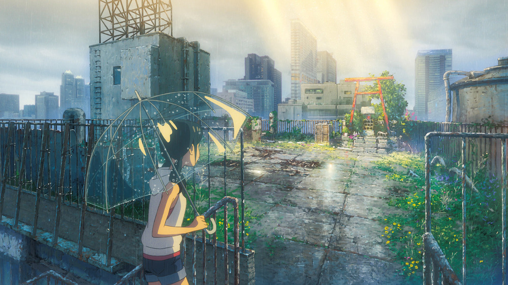 Hina Amano holding umbrella in rooftop garden