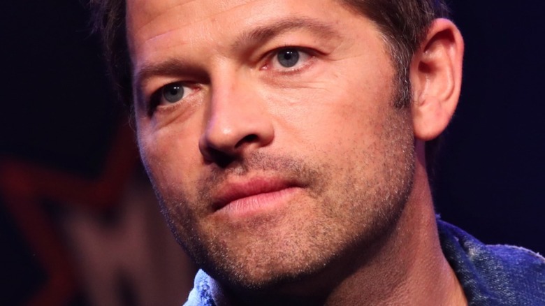 Misha Collins looking on 