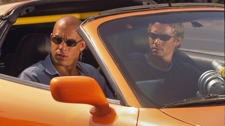 Dom Toretto and Brian O'Connor in orange car