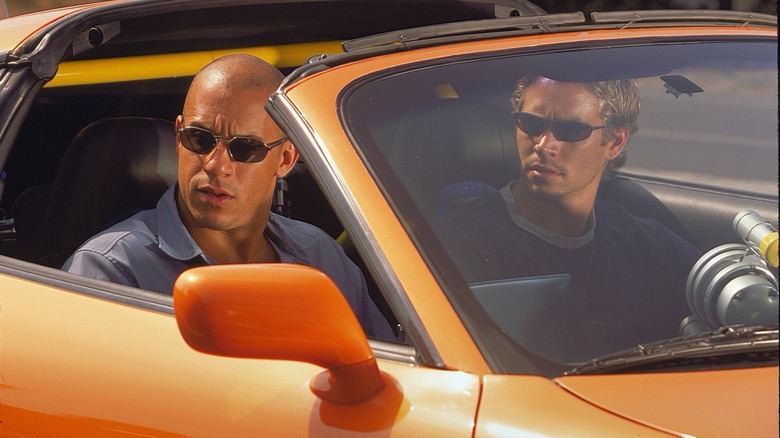 Dom Toretto and Brian O'Connor in orange car