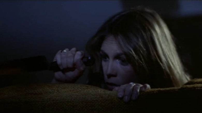 Laurie hiding on the couch