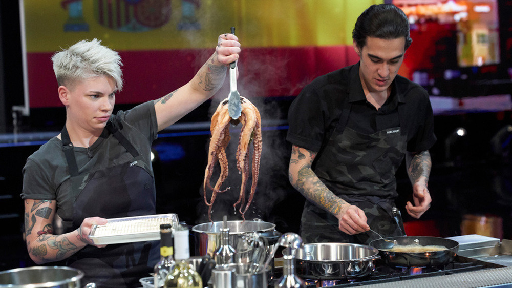 Contestants on The Final Table cooking with seafood