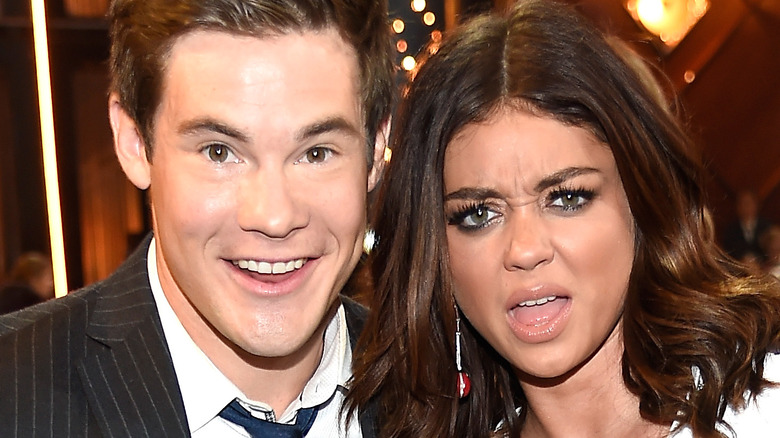 Adam Devine and Sarah Hyland posing 