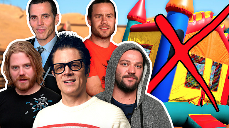 Jackass cast next to bounce house