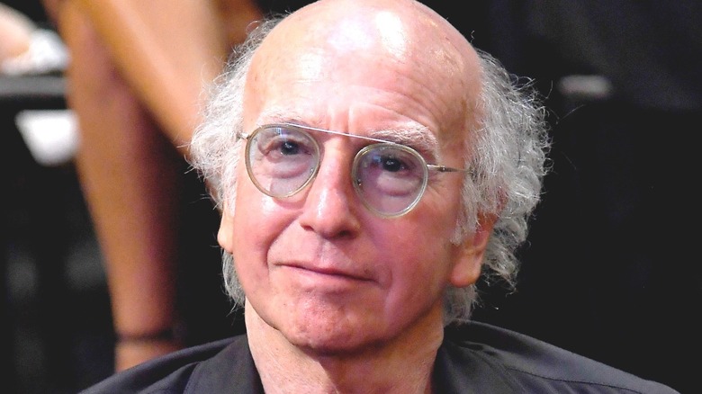 Larry David smirking