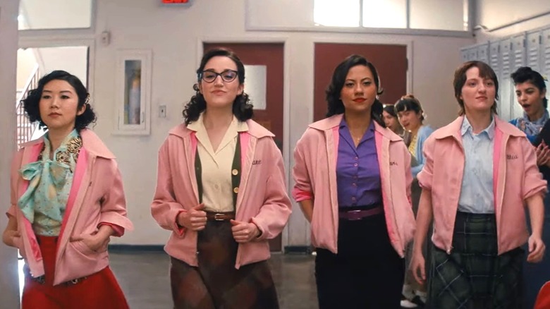 Pink Ladies walking hallway