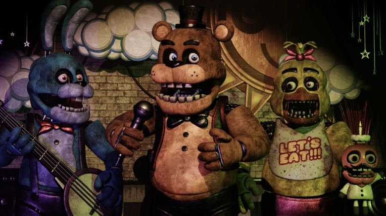 Bonnie, Freddy, Chica, and Mr. Cupcake on stage