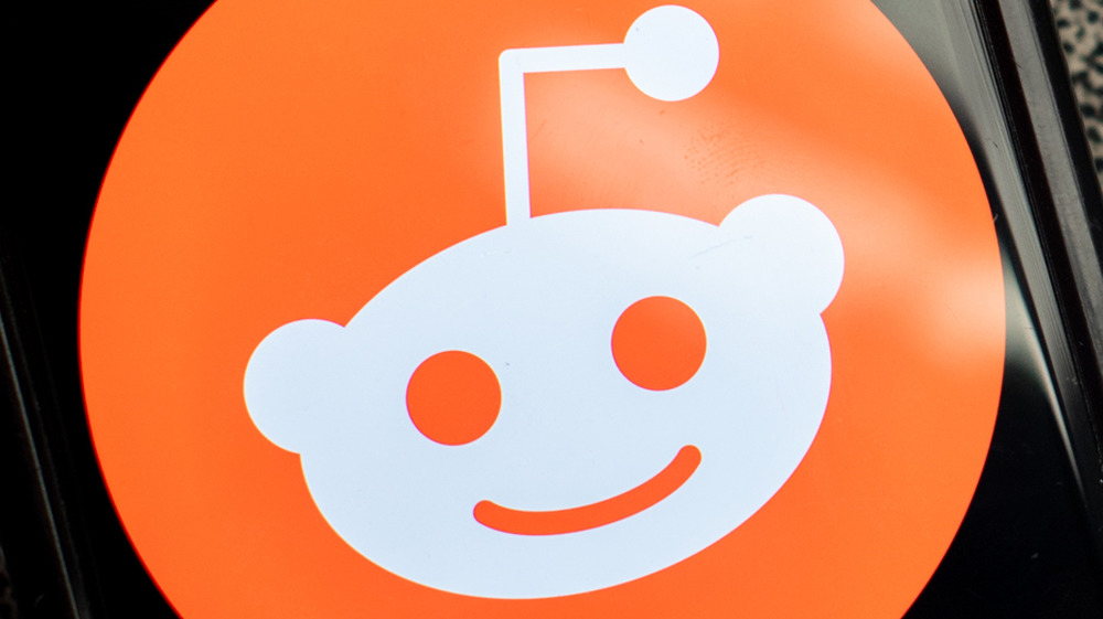 Reddit logo on a phone