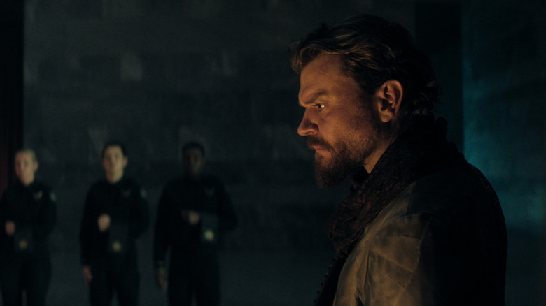 The Mule broods in a dark room in 
