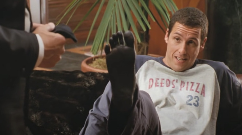 Deeds shows off his dead foot