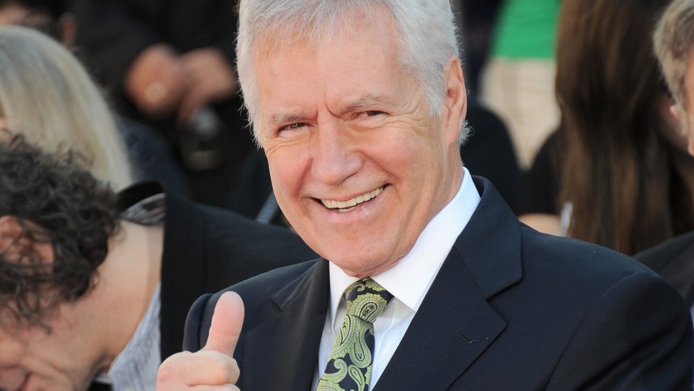 Alex Trebek giving a thumbs-up at a Hollywood Event