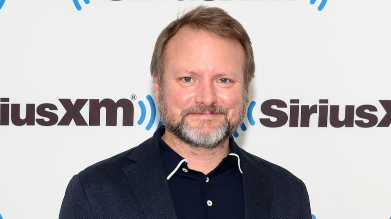 Rian Johnson smiles at event 