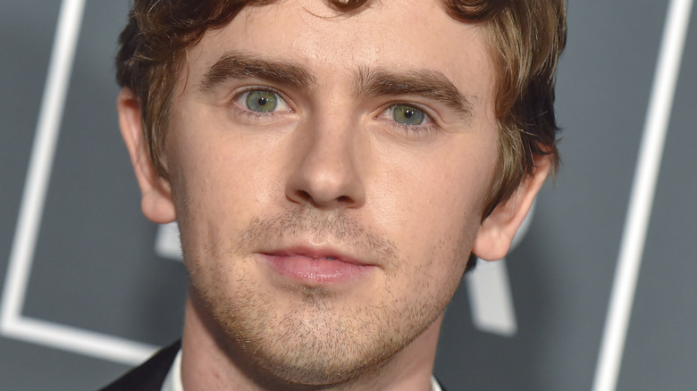 Freddie Highmore looking into camera