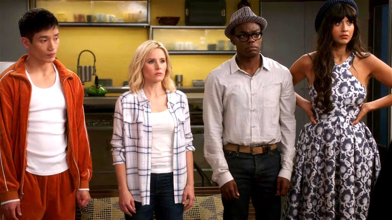 Jason, Eleanor, Chidi, and Tahani standing