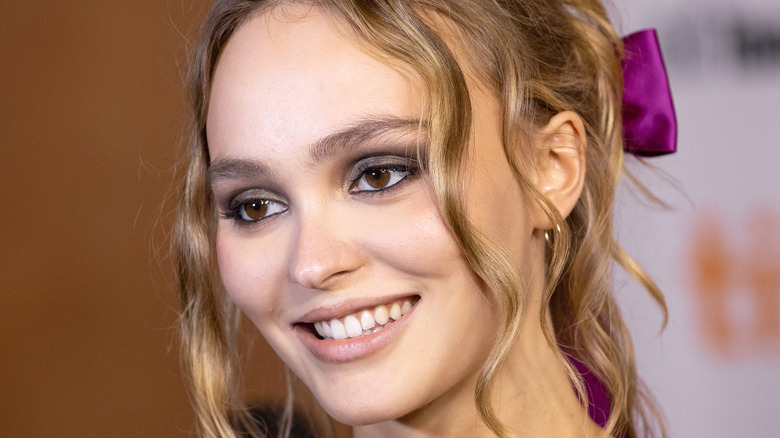 Lily-Rose Depp with purple hair accessory