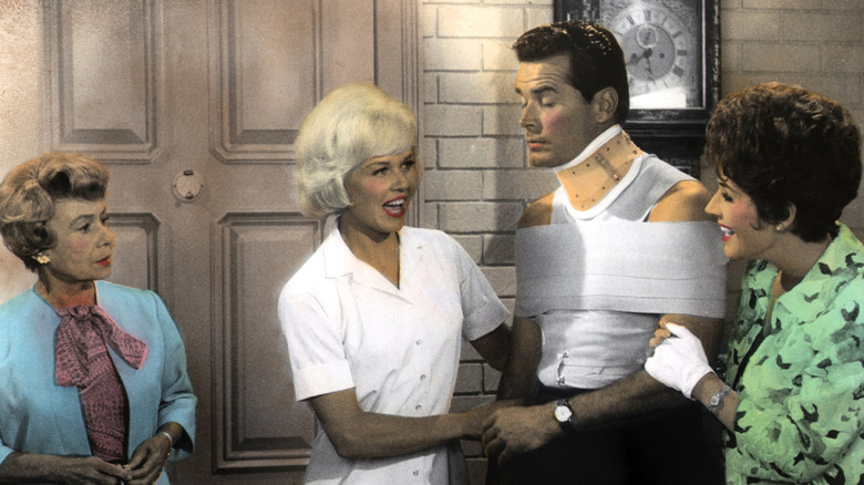 James Garner wears a neck brace