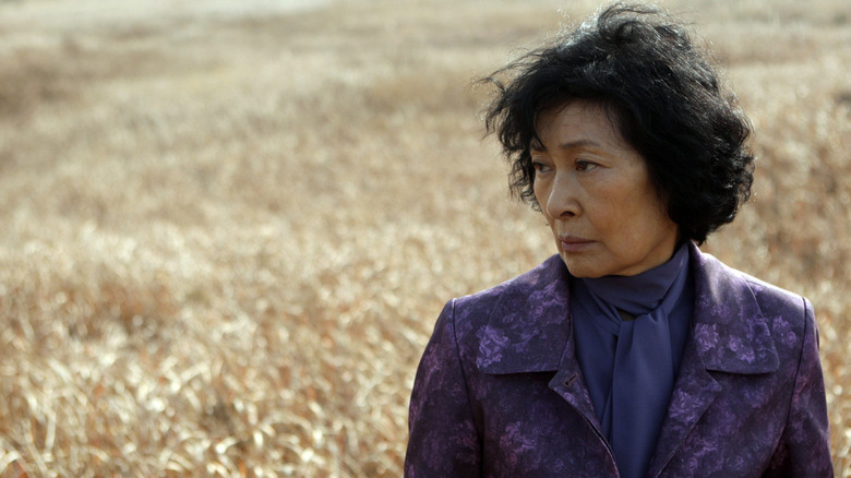 Mother stands in field