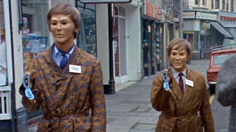 Autons raising handguns