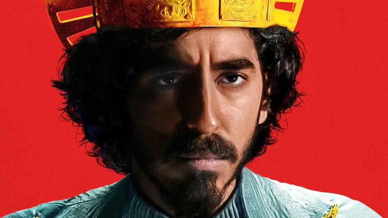 Dev Patel The Green Knight red background