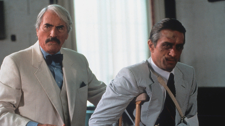 Lee Heller leads Max Cady out of court in "Cape Fear" (1991)