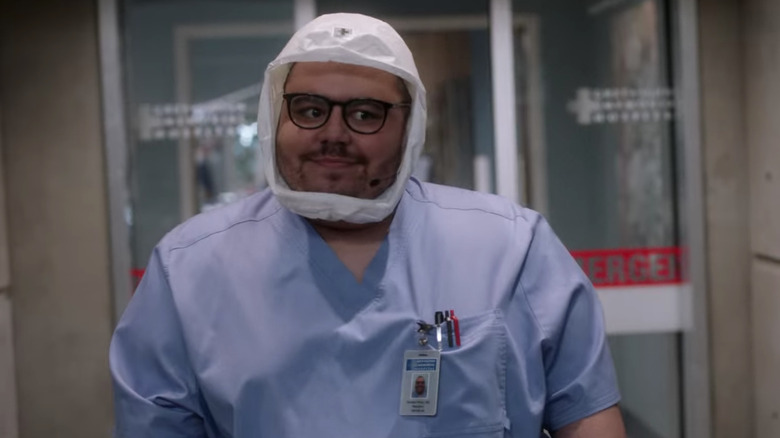 Zander Perez in scrubs and mask