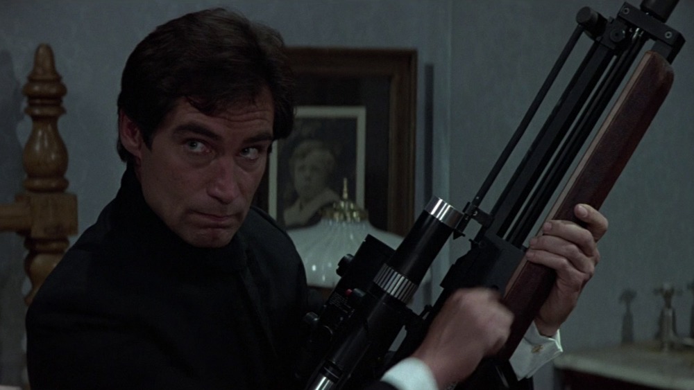 Timothy Dalton as James Bond holding gun