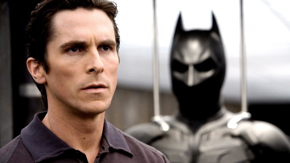 Christian Bale as Bruce Wayne with batman suit