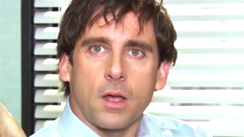 Michael Scott sitting in his office