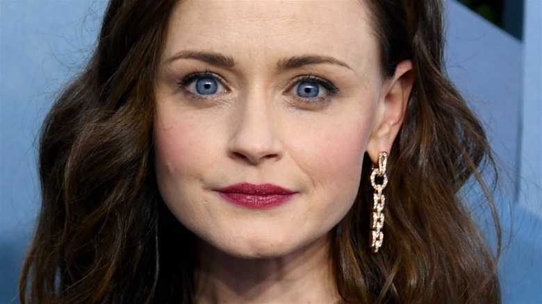 Alexis Bledel gets her picture taken at a premier 