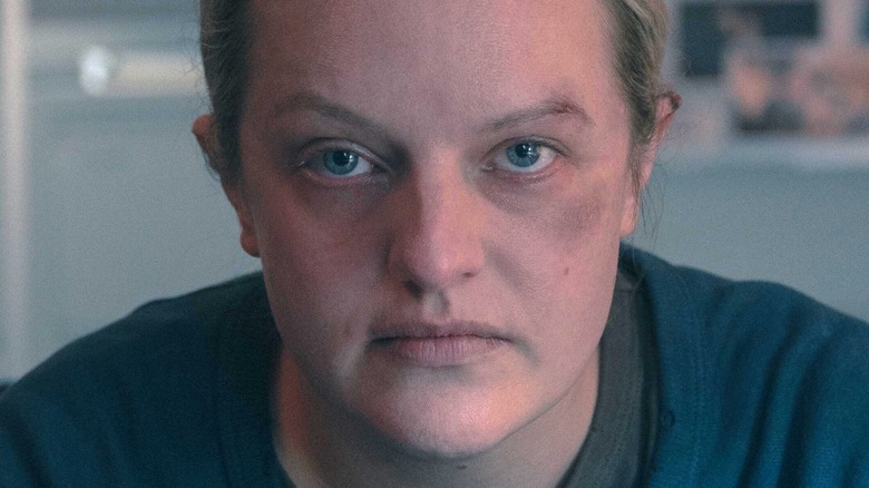 Elizabeth Moss stares into the camera as June on The Handmaid's Tale