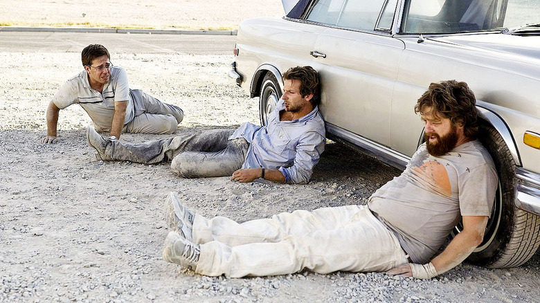 Phil, Stu, and Alan sit in the desert in "The Hangover" (2009)