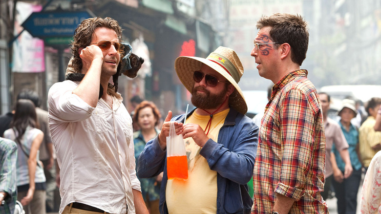 Phil, Stu, and Alan walk the streets of Thailand in "The Hangover Part II" (2011)