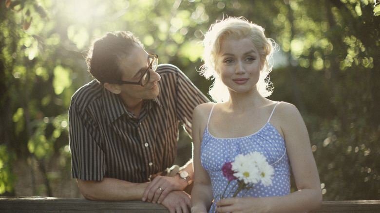 Arthur Miller looking at Marilyn Monroe in "Blonde"