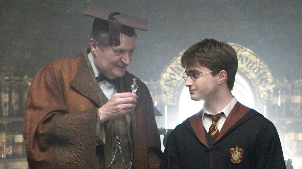 Professor Slughorn awards Harry 