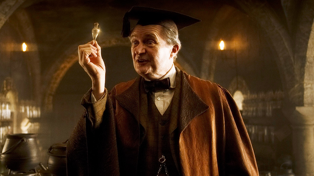 Horace Slughorn holding Felix Felicis