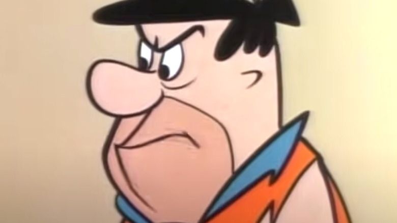 Fred Flintstone frowning