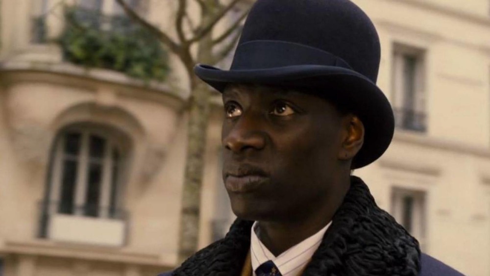 Lupin Omar Sy in a bowler hat