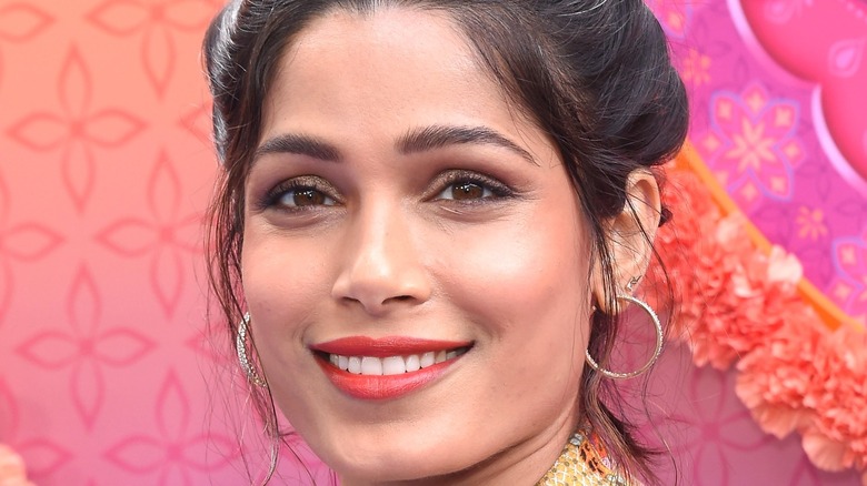 Freida Pinto smiling at an event