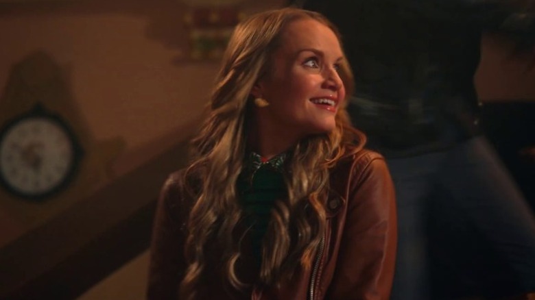 Miss Jenn smiles at her students