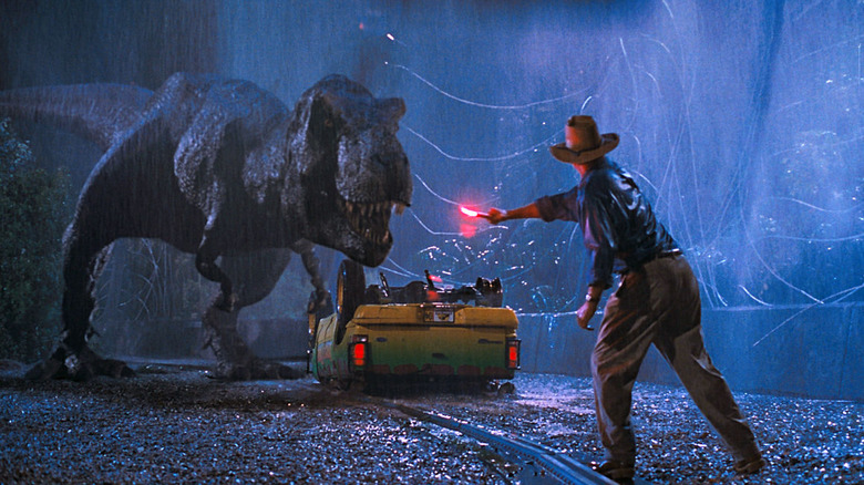 (from left to right) T-Rex, Sam Neil in Jurassic Park