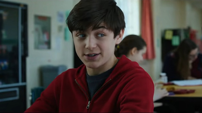 Billy Batson smiling in classroom 