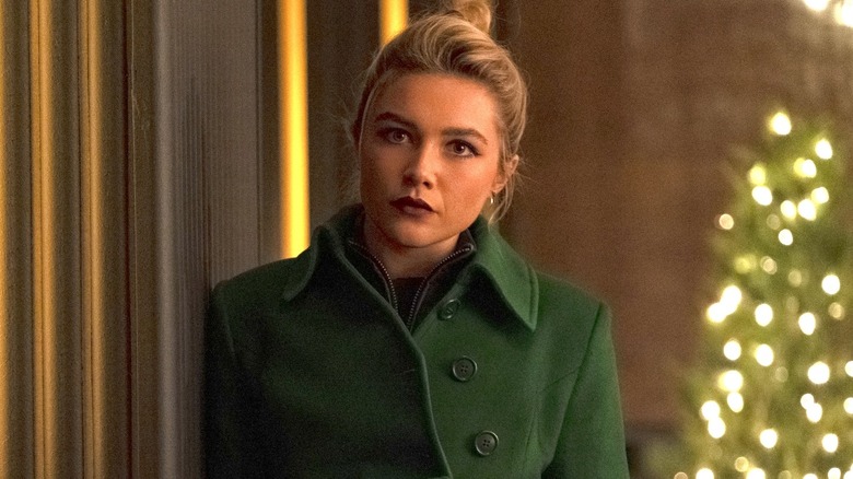 Yelena looking upset in green coat 