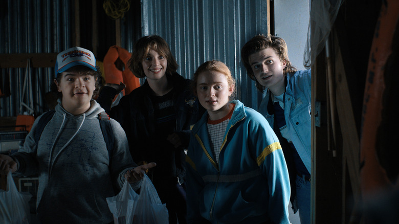 Gaten Matarazzo as Dustin Henderson, Maya Hawke as Robin Buckley, Sadie Sink as Max Mayfield, and Joe Keery as Steve Harrington in STRANGER THINGS