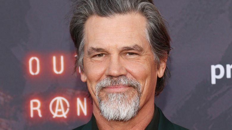 Josh Brolin smiling with goatee