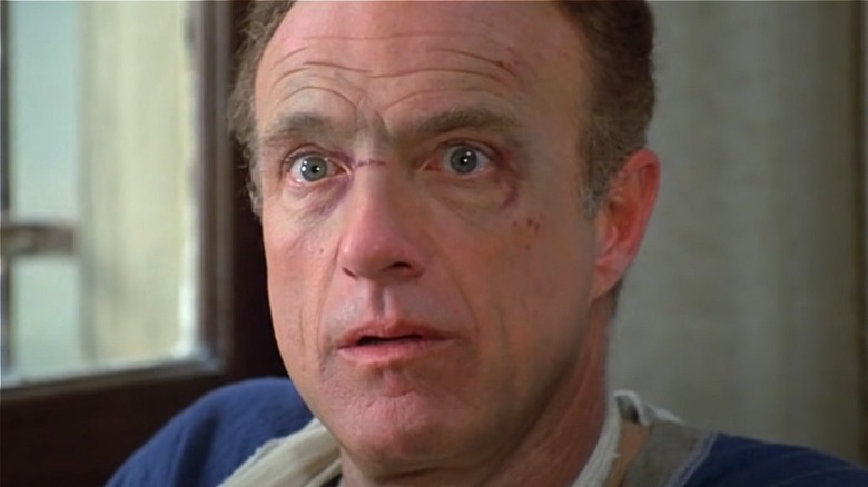 James Caan as Paul Sheldon looking terrified